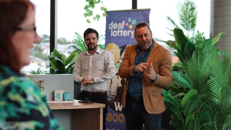 A conversation at a Deaf Lottery event