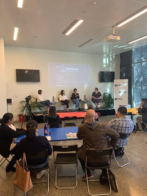 Bec on the panel stage at Brisbane Business Hub with the audience in view